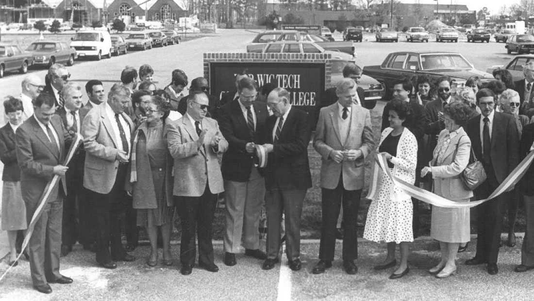 group of people at a ribbon cutting ceremony