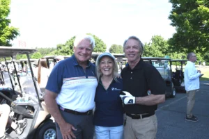 3 people about to golf