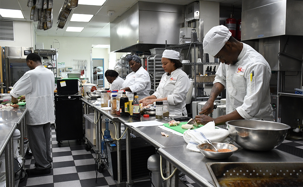 students working in a kitchen