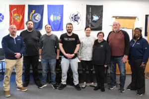 Group of veteran students with the director of the program and the dean of student success