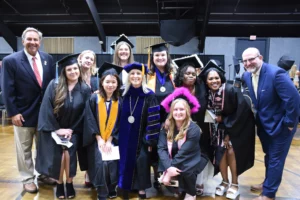 group of grads with government officials