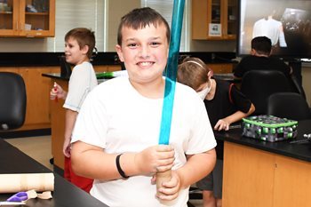 Summer Scholars student at Wor-Wic with a light saber