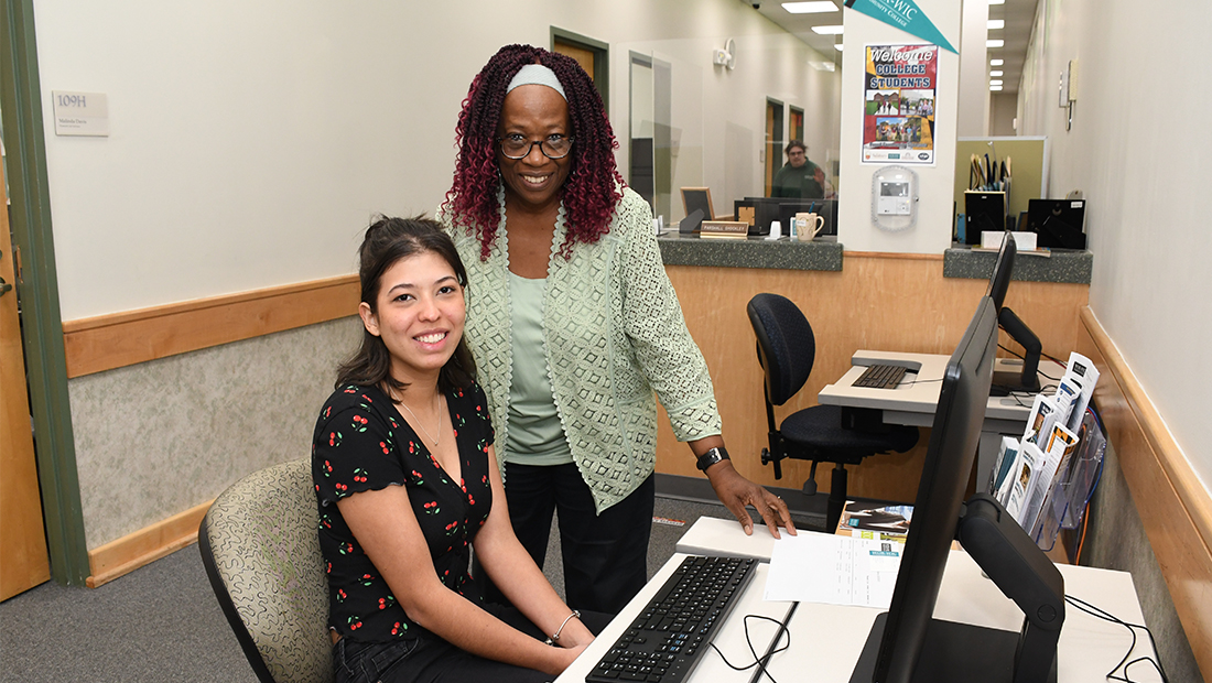 an employee helping a student